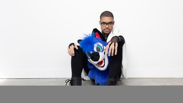 SonicFox sitting with mask on lap